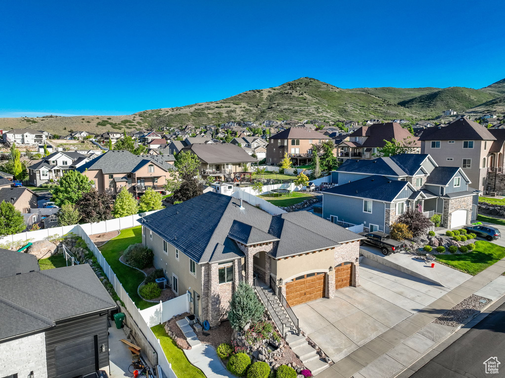 Aerial perspective of suburban area with a mountain backdrop