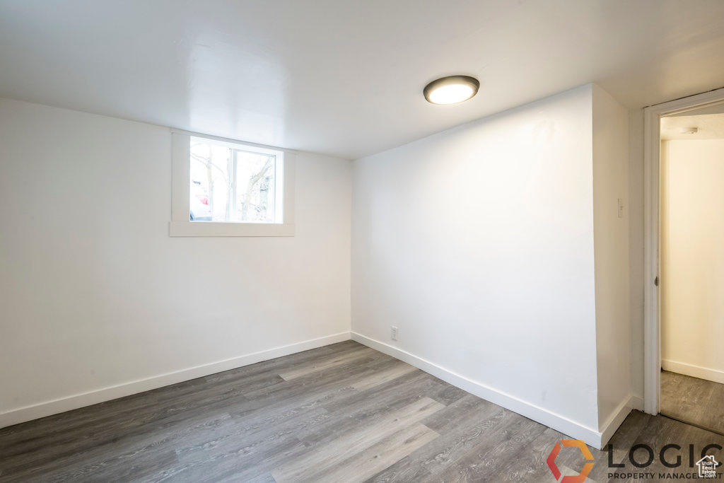 Basement featuring wood finished floors and baseboards