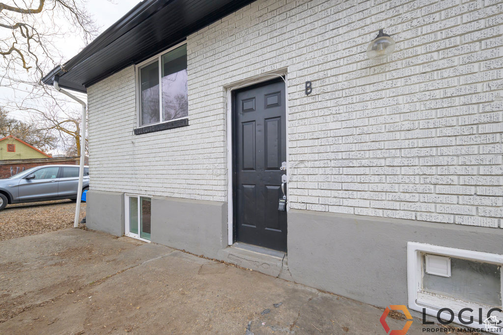 Entrance to property with brick siding