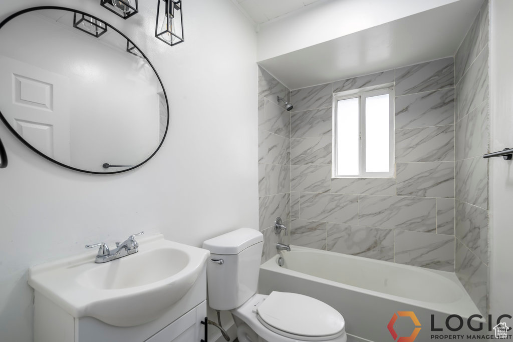 Full bathroom featuring vanity, toilet, and bathing tub / shower combination