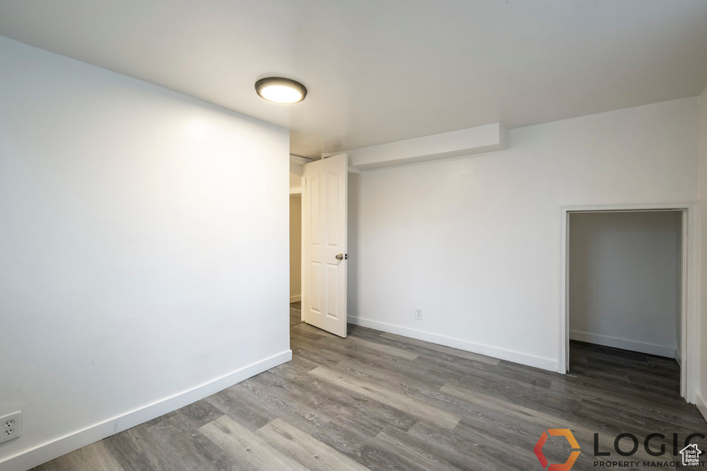 Spare room with wood finished floors and baseboards
