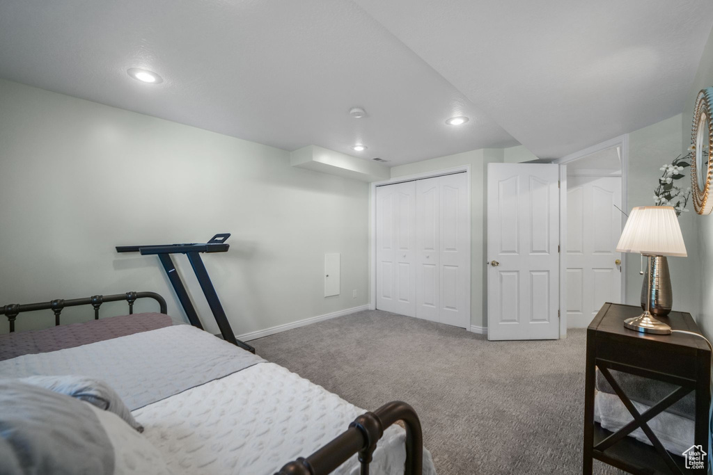 Bedroom with recessed lighting, carpet floors, baseboards, and a closet
