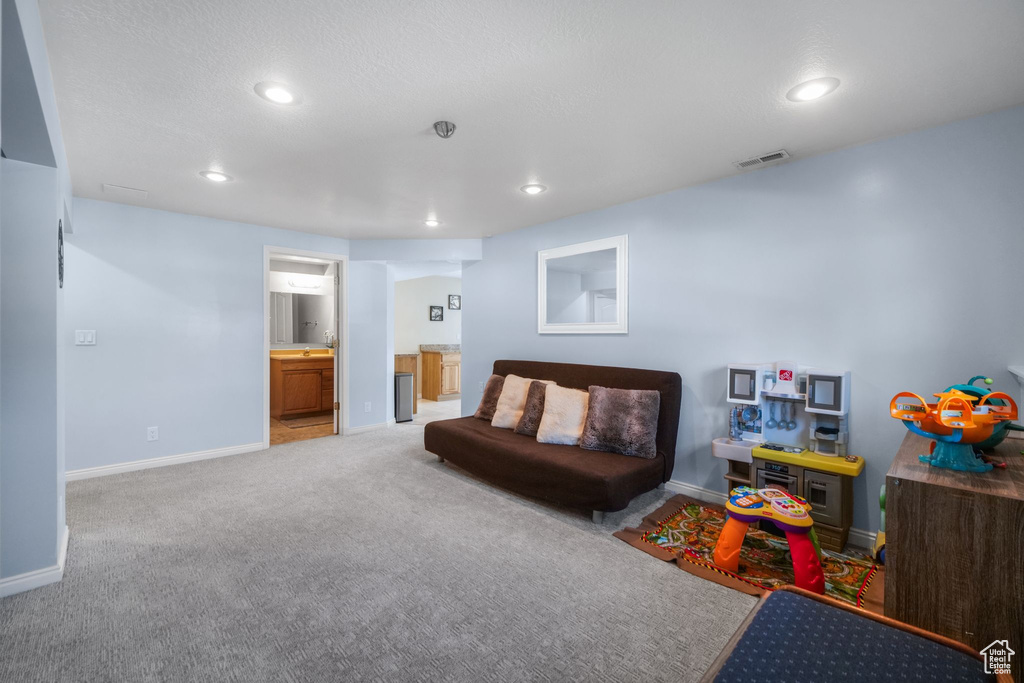 Game room with baseboards, recessed lighting, and carpet floors