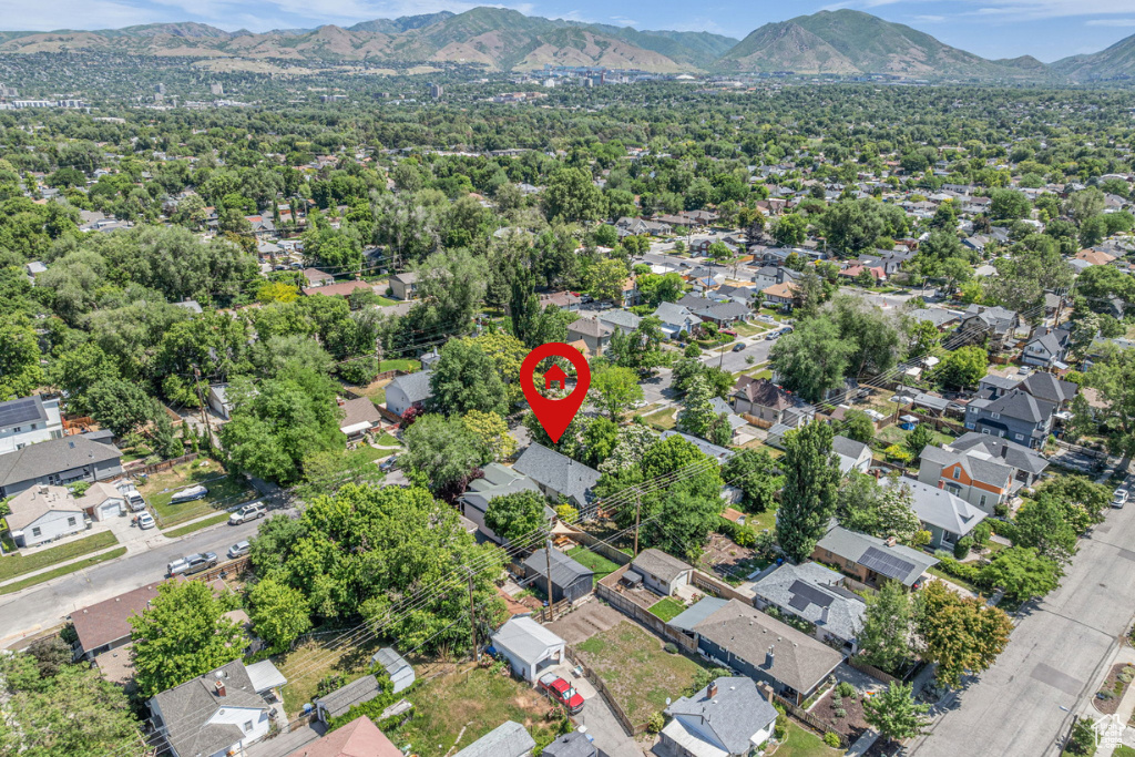 View of property location featuring mountains and nearby suburban area