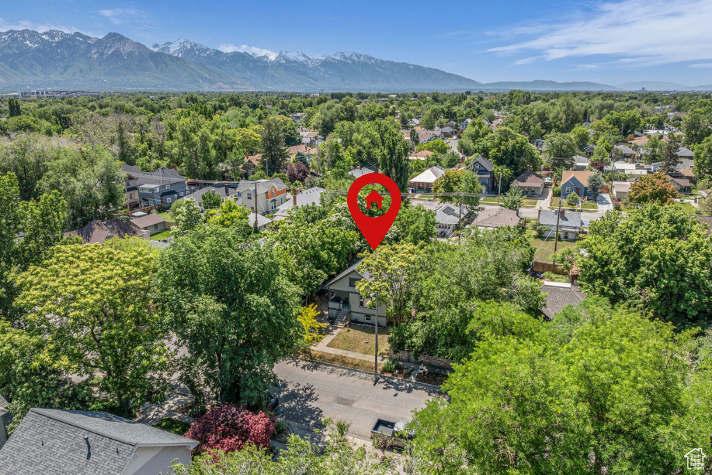 Aerial view of residential area featuring a mountain backdrop