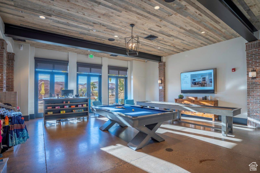 Game room with pool table and wood ceiling
