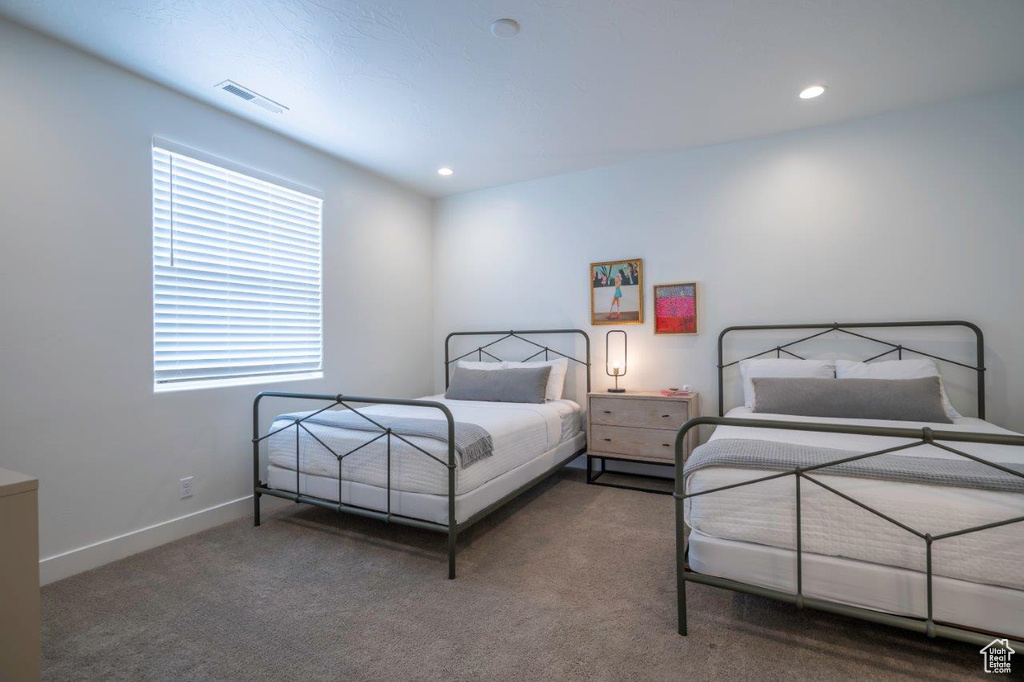 Carpeted bedroom featuring recessed lighting and baseboards