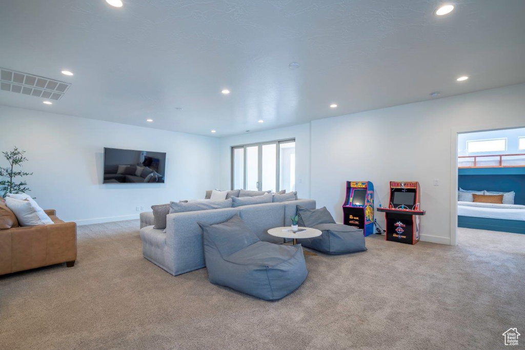 Living room with carpet, recessed lighting, and baseboards