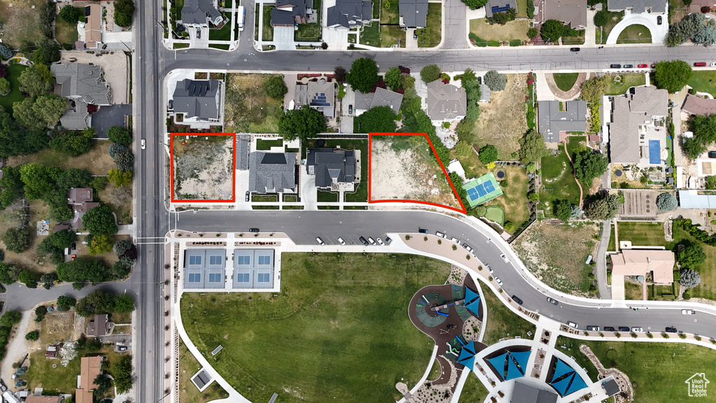 Aerial view of residential area with property parcel outlined