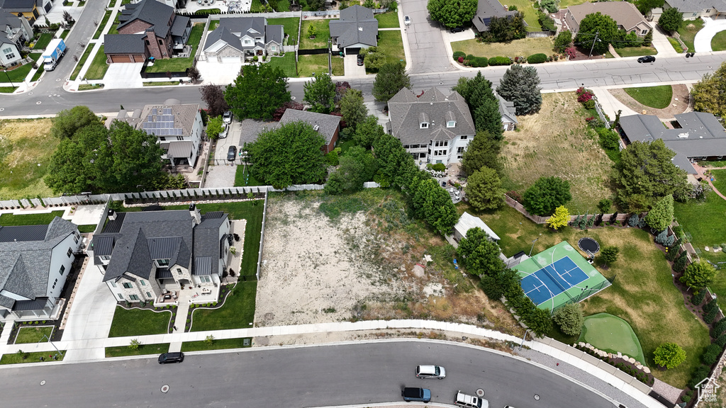 Aerial view of property and surrounding area with nearby suburban area