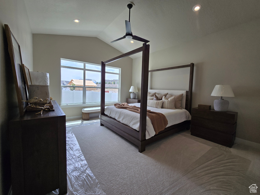 Bedroom with carpet floors, lofted ceiling, a ceiling fan, recessed lighting, and baseboards
