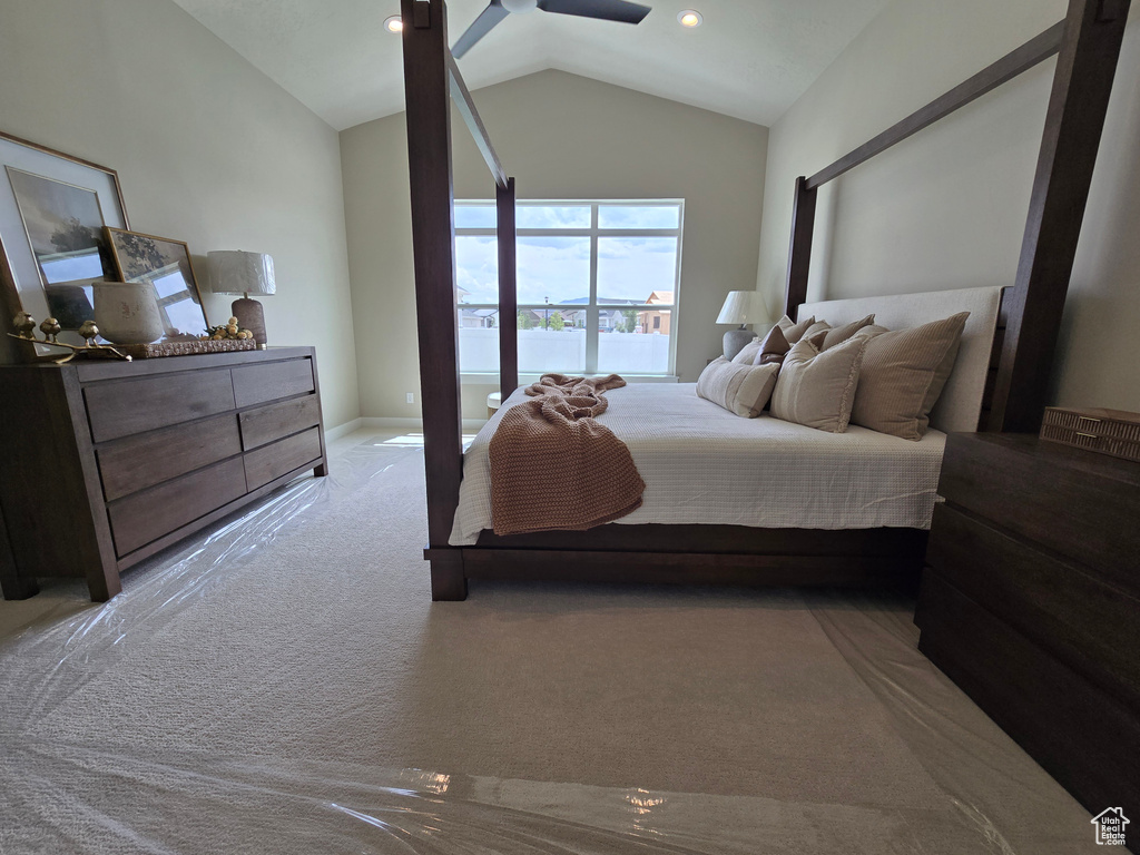 Carpeted bedroom featuring lofted ceiling, baseboards, and recessed lighting
