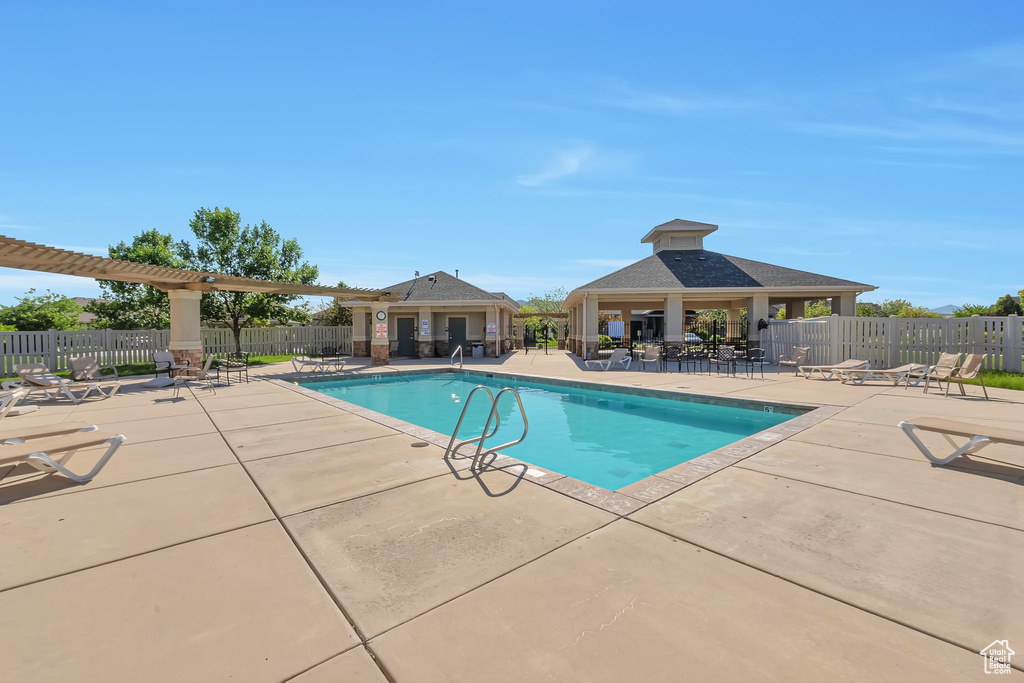 Community pool with a patio and a gazebo