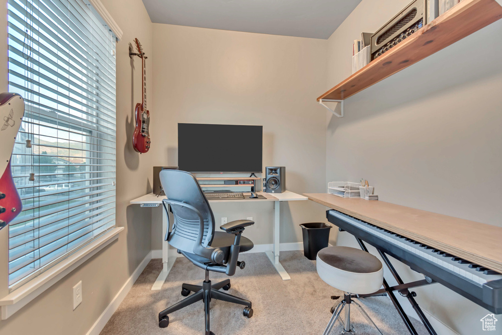 Carpeted office featuring baseboards