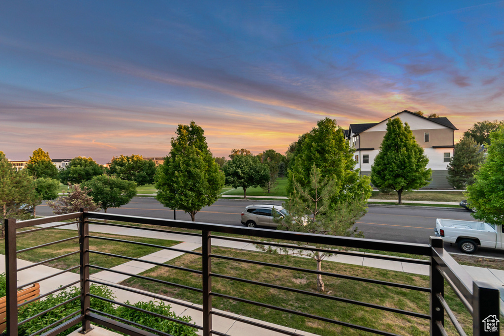 View of yard featuring a balcony