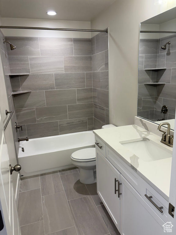 Full bath with vanity, shower / bath combination, toilet, and recessed lighting