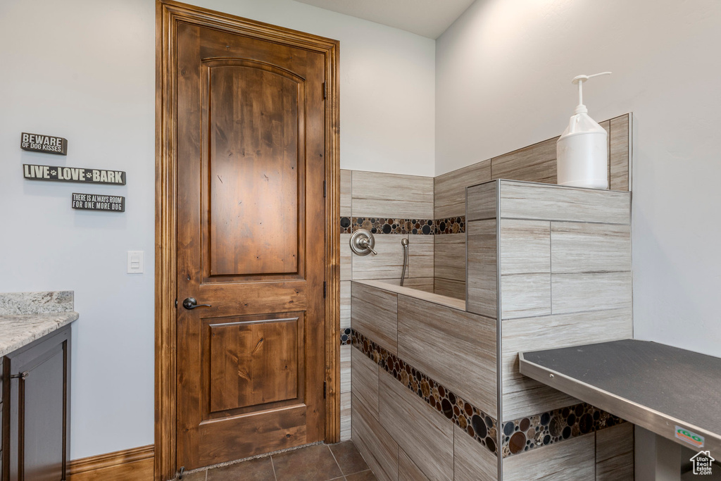 Bathroom with tile patterned flooring and vanity