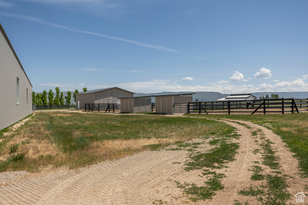 View of yard featuring an outdoor structure, an outbuilding, and an exterior structure
