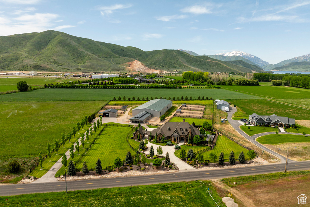 Overview of rural landscape with farmland and a mountain backdrop