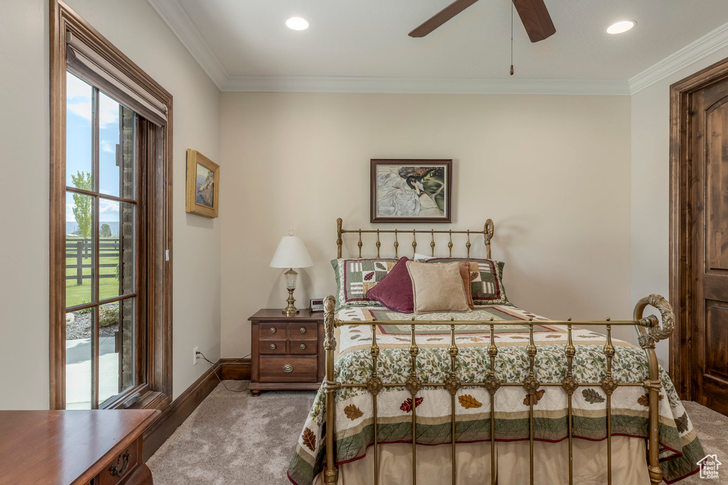 Carpeted bedroom featuring ornamental molding, baseboards, access to exterior, and recessed lighting