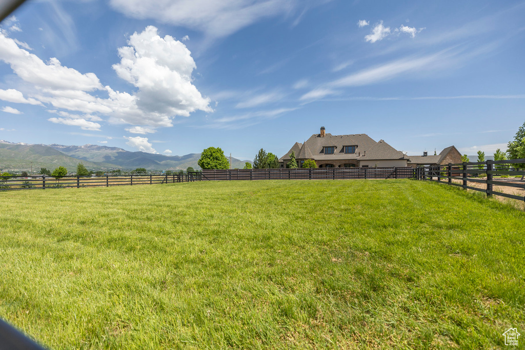 View of yard with a view of countryside and a mountain view