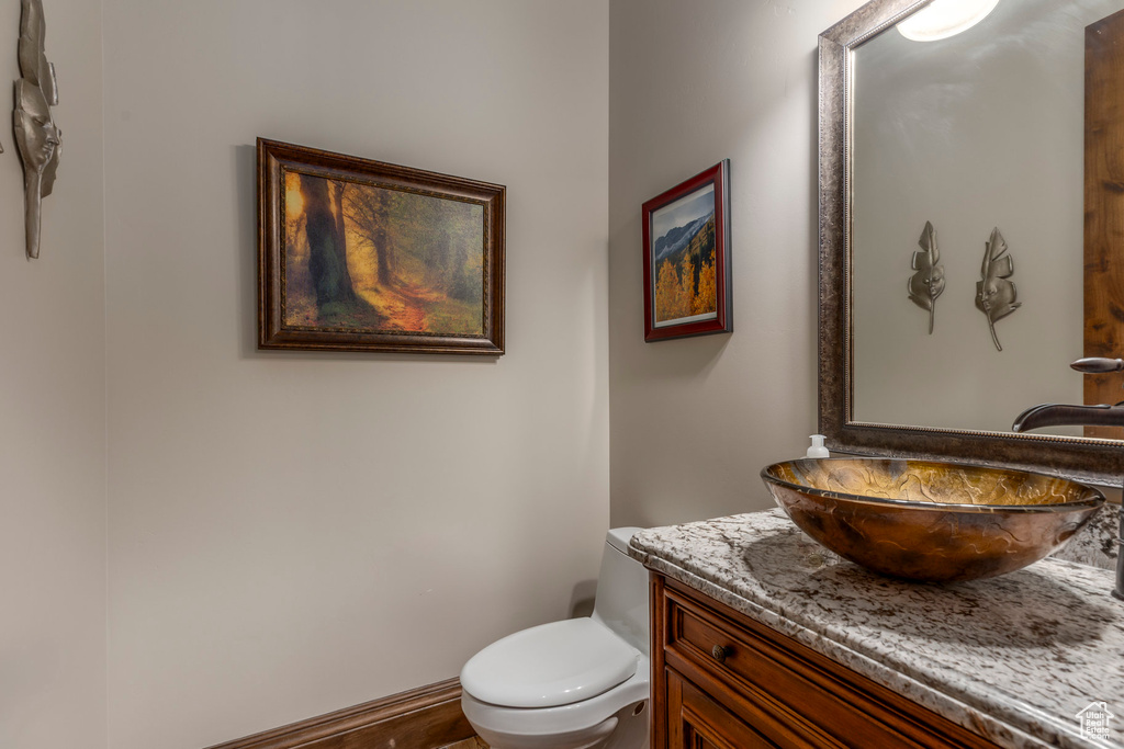 Half bath with vanity and toilet