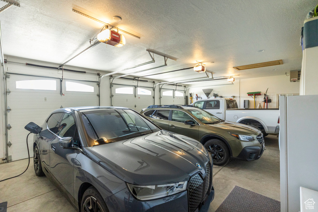 Garage featuring a garage door opener