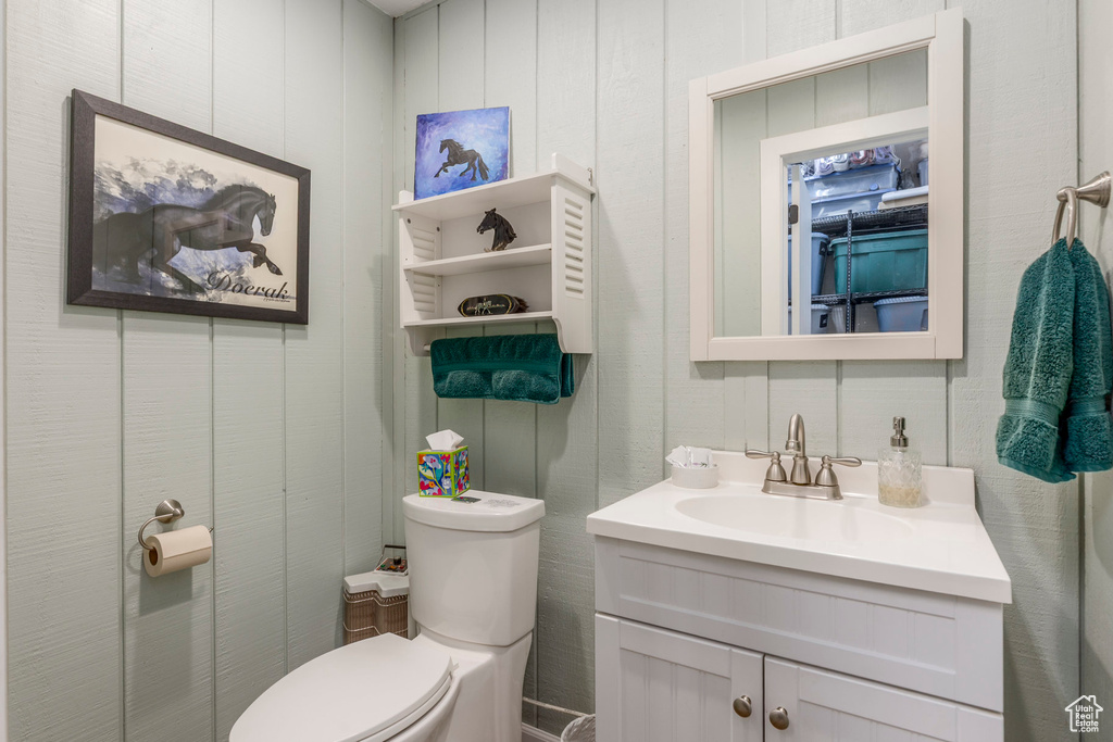 Half bath with vanity and toilet