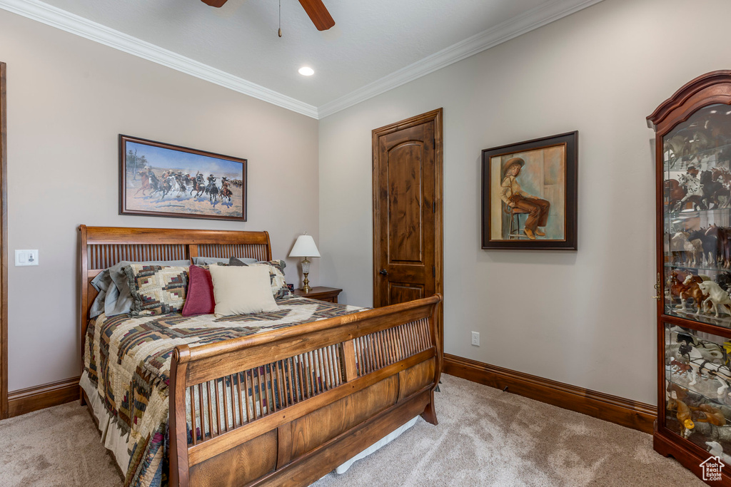 Carpeted bedroom with baseboards, ornamental molding, ceiling fan, and recessed lighting