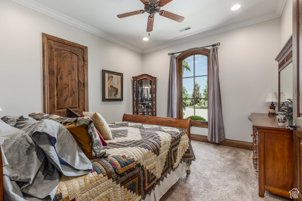 Bedroom with light carpet, recessed lighting, crown molding, baseboards, and a ceiling fan