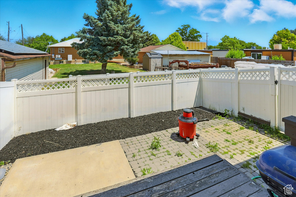Fenced backyard featuring a patio area