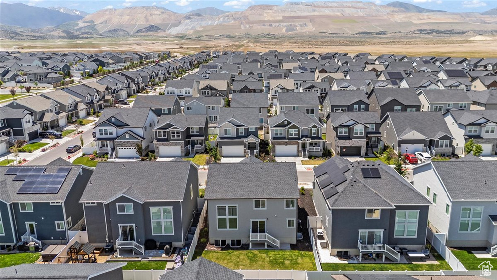 Aerial view of residential area featuring a mountain backdrop