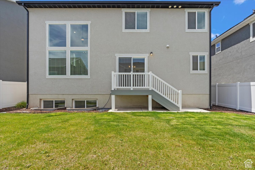 Back of property with stucco siding