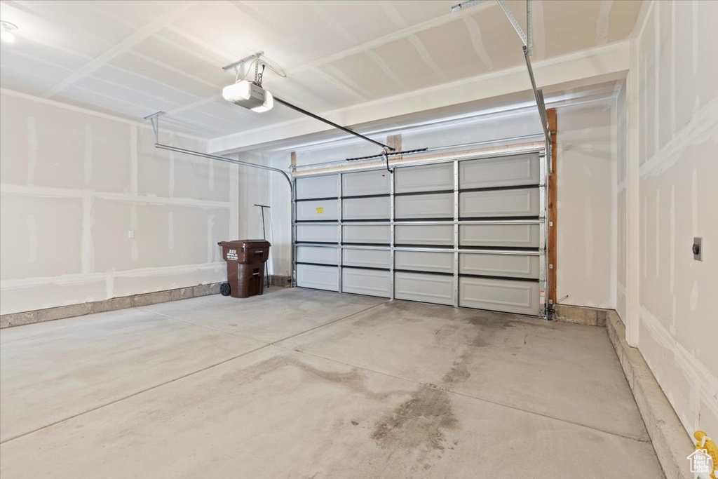 Garage featuring a garage door opener