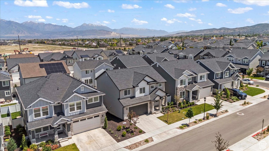 Aerial view of residential area featuring a mountain backdrop