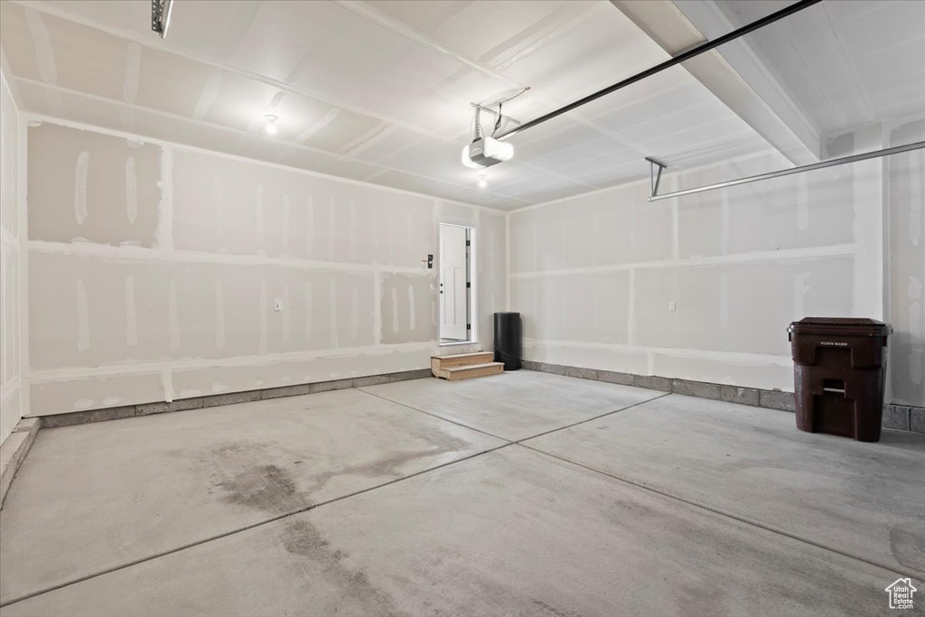 Garage featuring a garage door opener