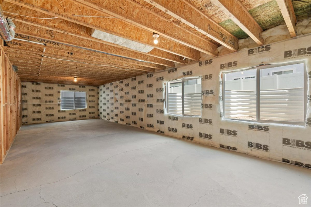 Spare room with unfinished concrete flooring