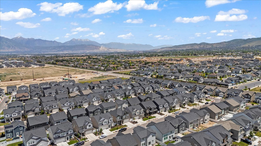 Aerial perspective of suburban area with a mountainous background