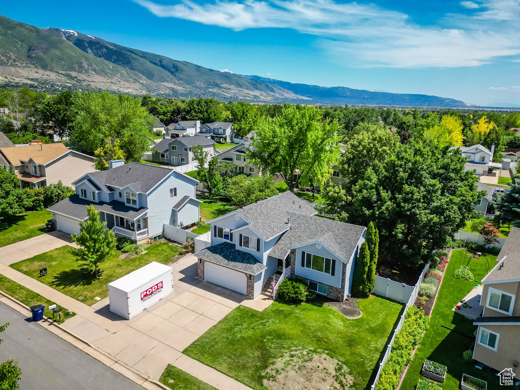 Aerial perspective of suburban area featuring a mountain backdrop