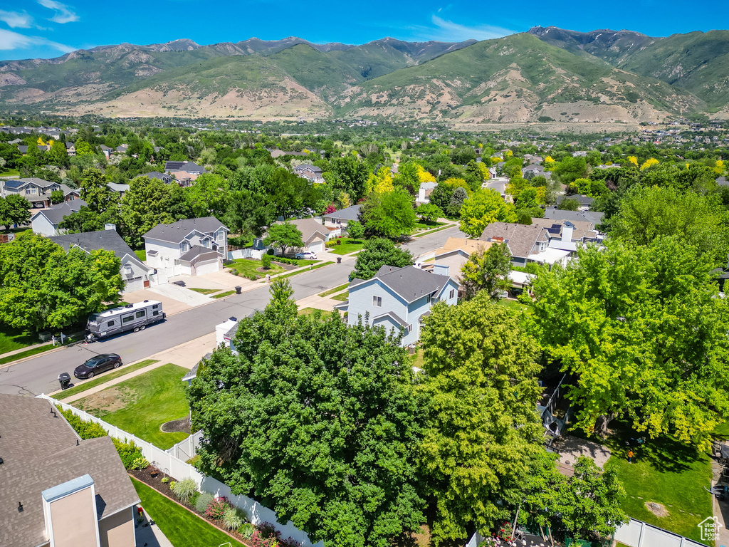 Aerial view of residential area featuring mountains
