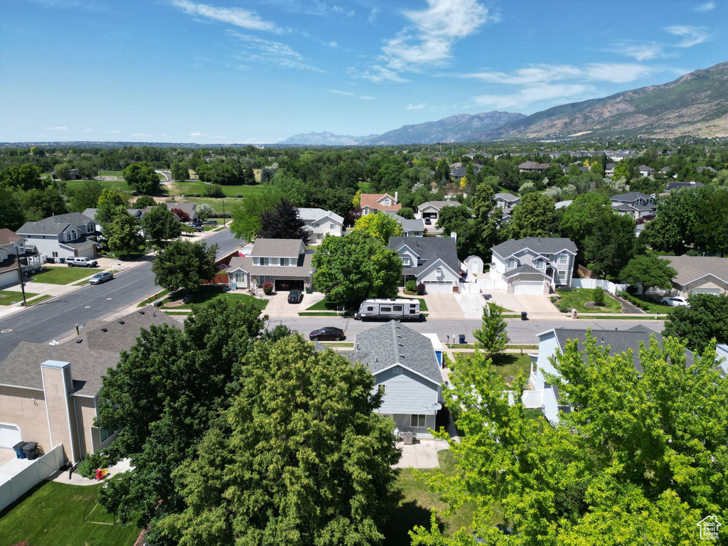Aerial view of residential area with a mountainous background
