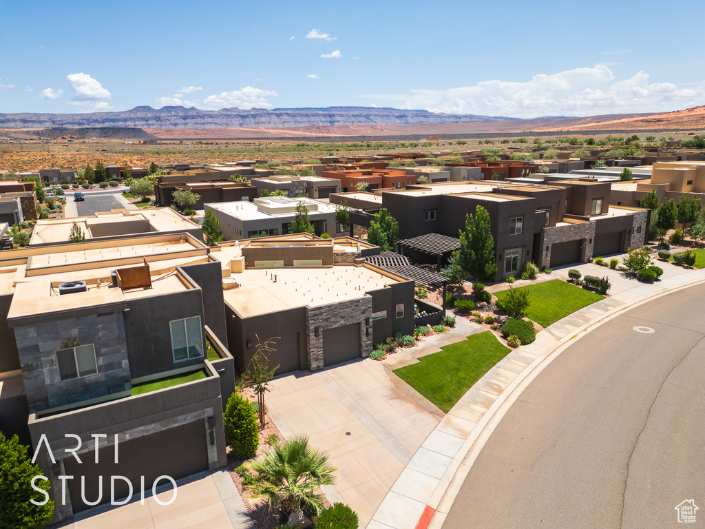 Aerial view of residential area featuring mountains