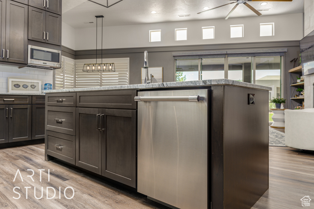 Kitchen with stainless steel appliances, ceiling fan, plenty of natural light, light wood-type flooring, and recessed lighting