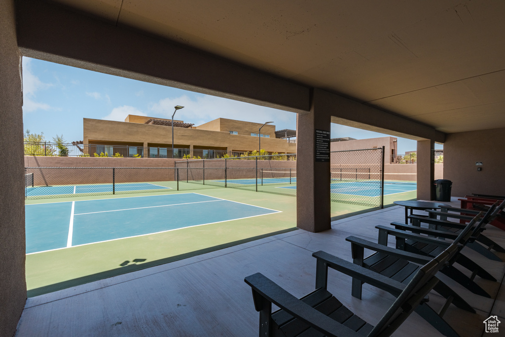 View of tennis court with community basketball court