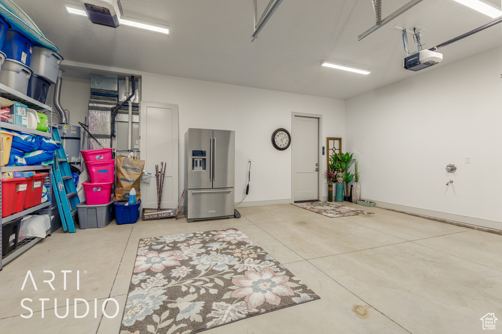 Garage with high quality fridge and a garage door opener