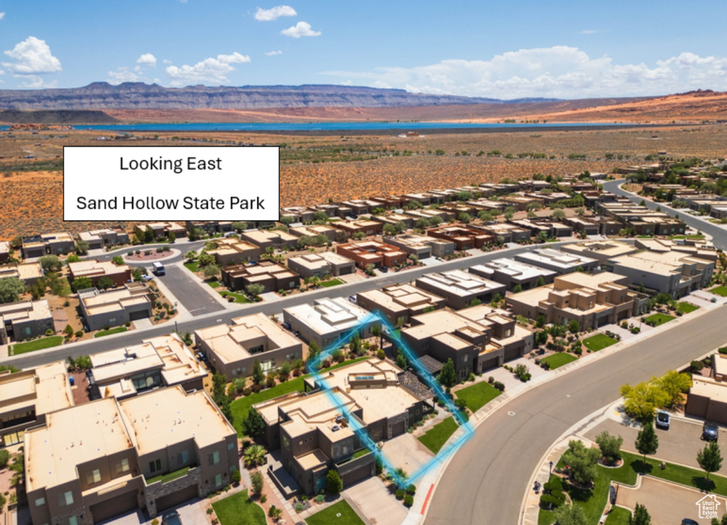 Aerial view of residential area with a mountainous background