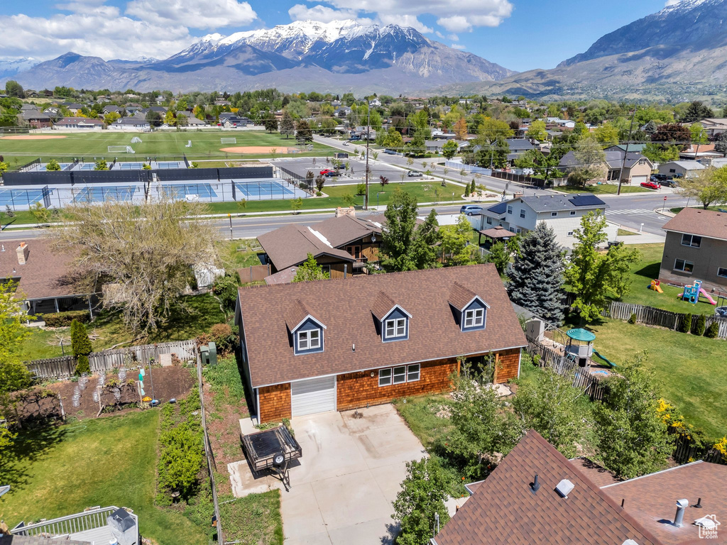 Aerial view of residential area with a mountainous background