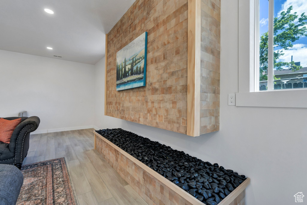 Sitting room featuring recessed lighting, wood finished floors, and baseboards