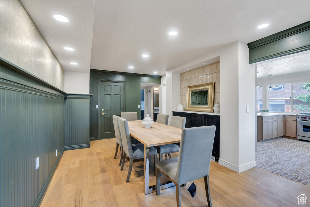 Dining space featuring light wood finished floors, recessed lighting, and baseboards