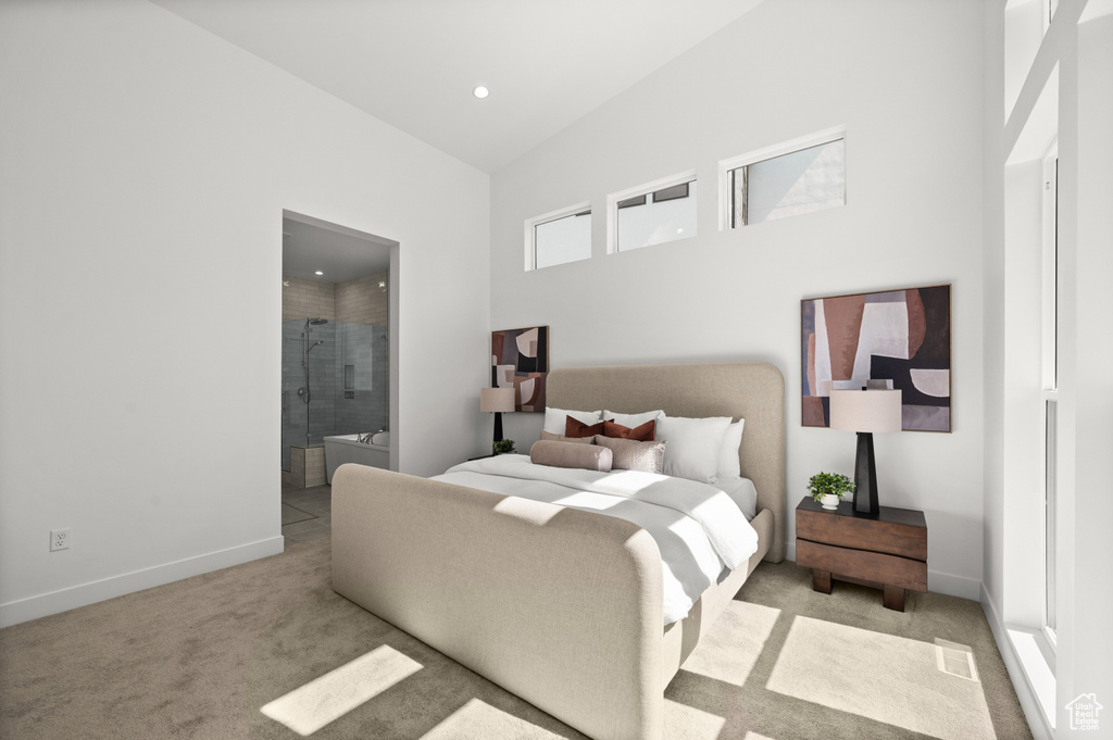 Bedroom with carpet flooring, a towering ceiling, baseboards, recessed lighting, and connected bathroom